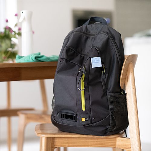 Air monitoring backpack on a chair