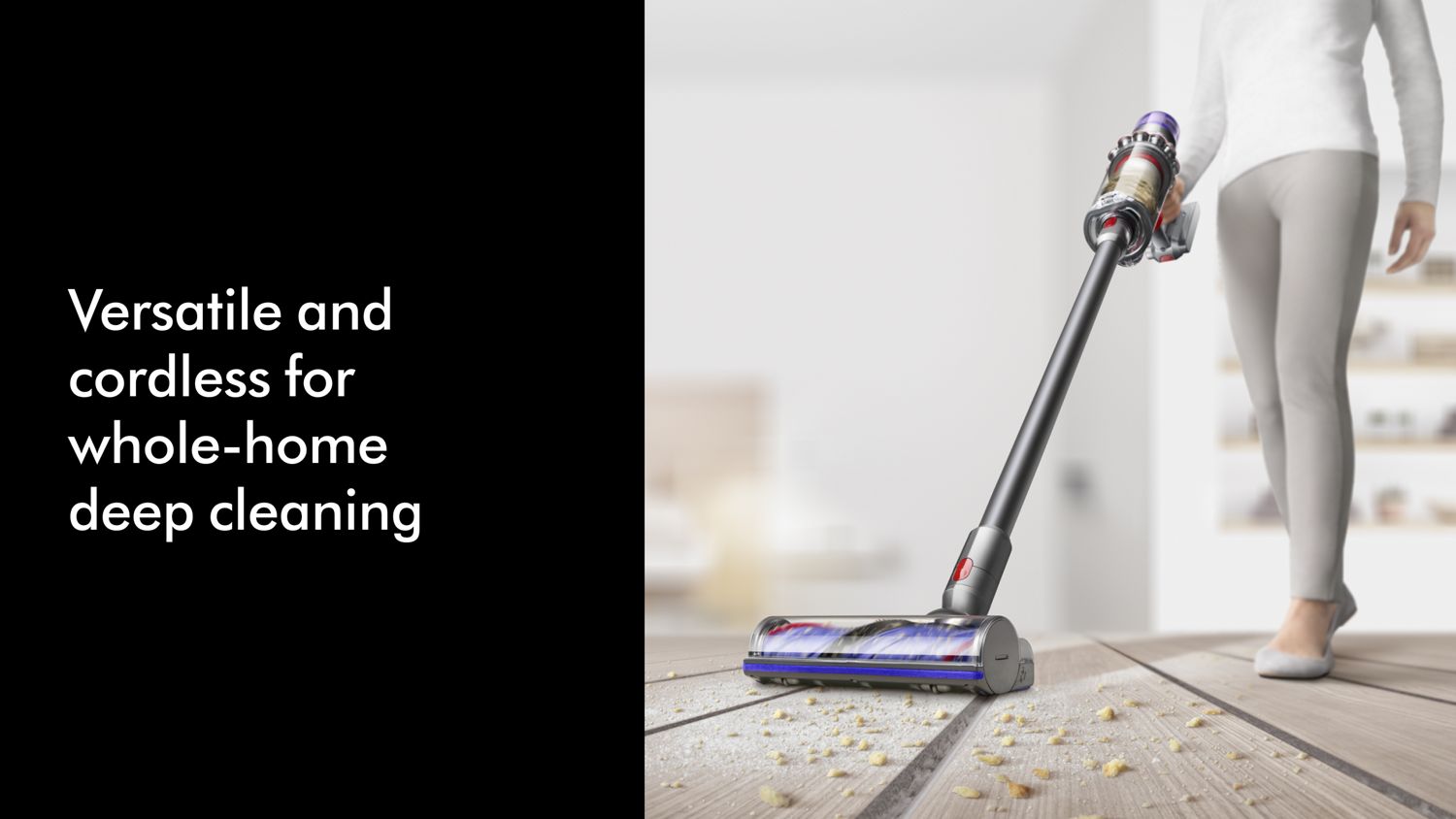 The Dyson V11 is used to clean debris on a hard floor.