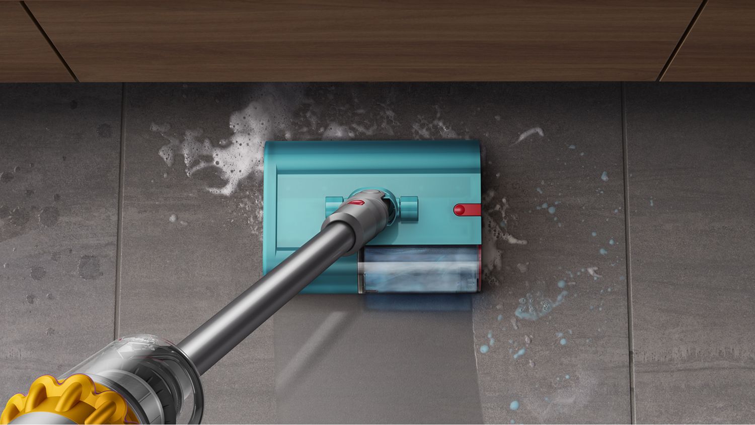 A close up of the Submarine™ cleaner head cleaning a spill on a tiled floor.