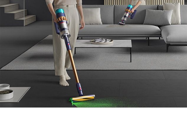  Woman vacuuming floor using the Dyson Cyclone V10 vacuum cleaner