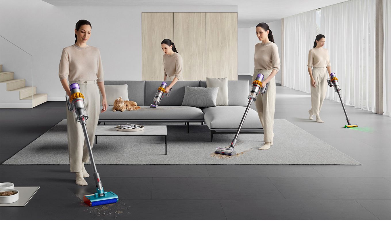 An aerial view of a Dyson wet and dry cleaner removing debris and spills on a tile floor 