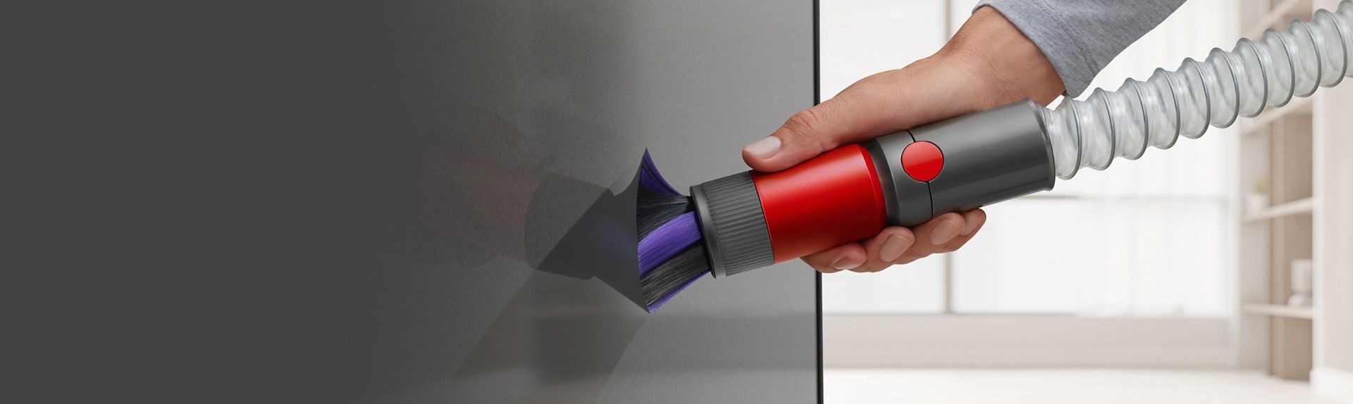 Scratch-free dusting brush cleaning a TV screen