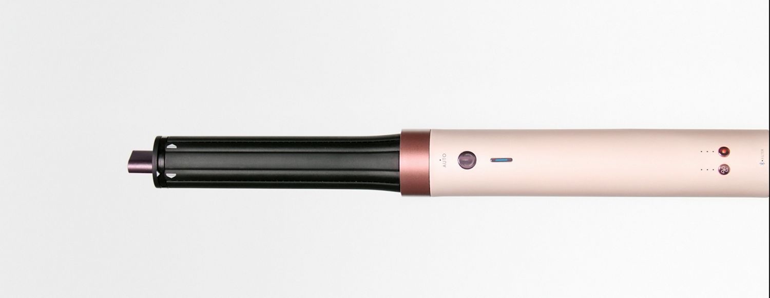 Splitscreen of the Dyson Airwrap Co-anda2x multi-styler and dryer, and a blonde model with hair styled with the device.