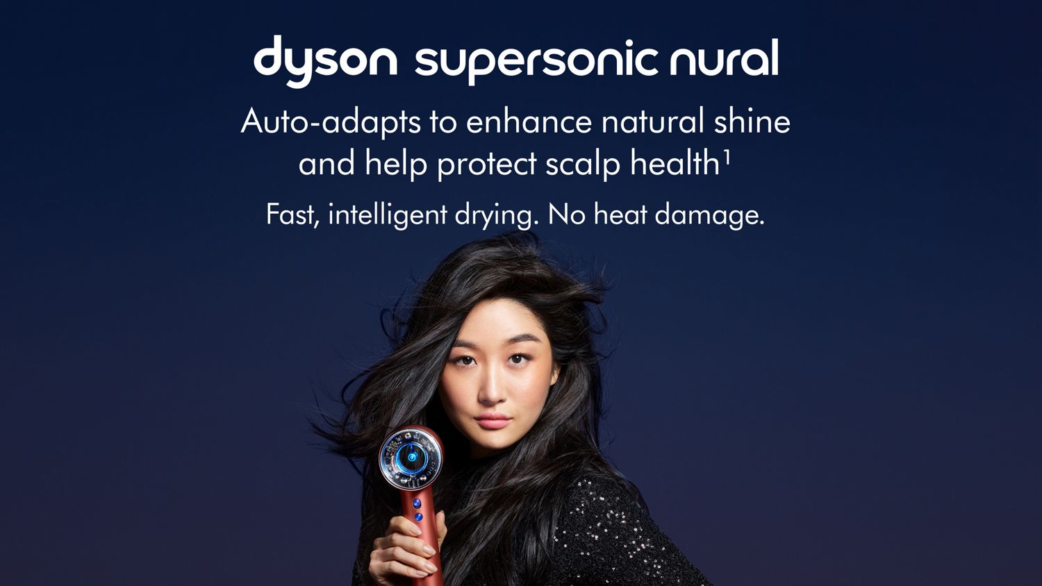 The Dyson Supersonic Nural hair dryer held by a model.