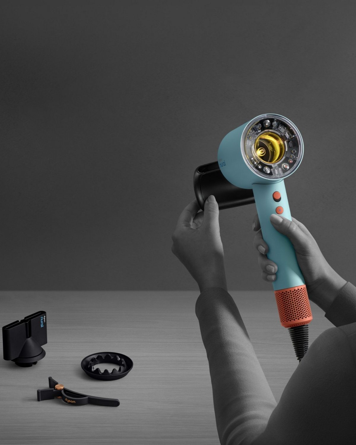 The Flyaway attachment is attached to the Dyson Supersonic Nural hair dryer and settings are automatically adjusted.