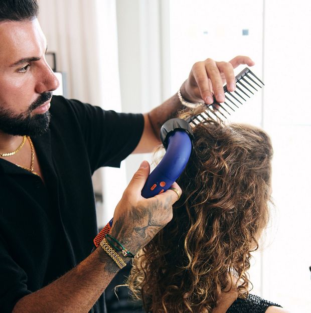 Sebastian styling model hair with supersonic r