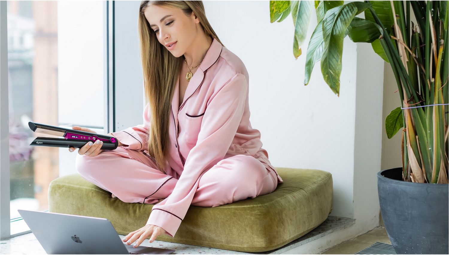 Model with Dyson Corrale straightener. 