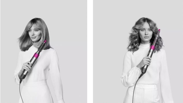 Two models using the new Dyson Airwrap styler attachments.