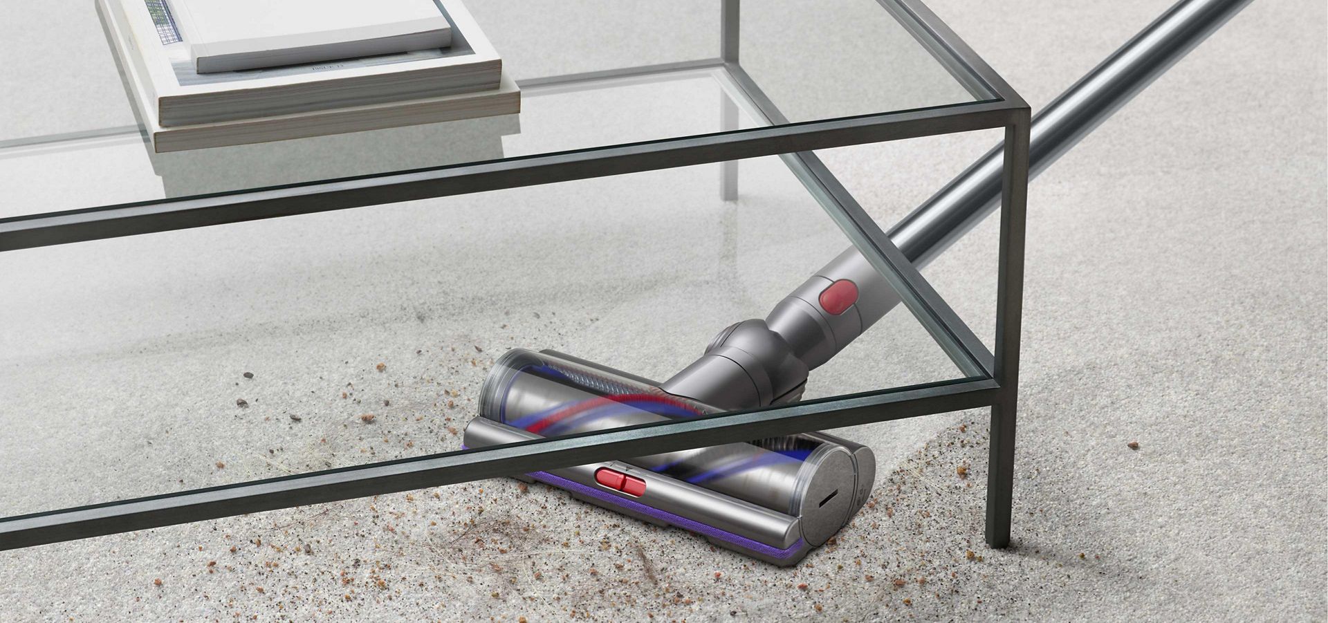 Vacuum cleaner used to vacuum dust and dirt underneath coffee table