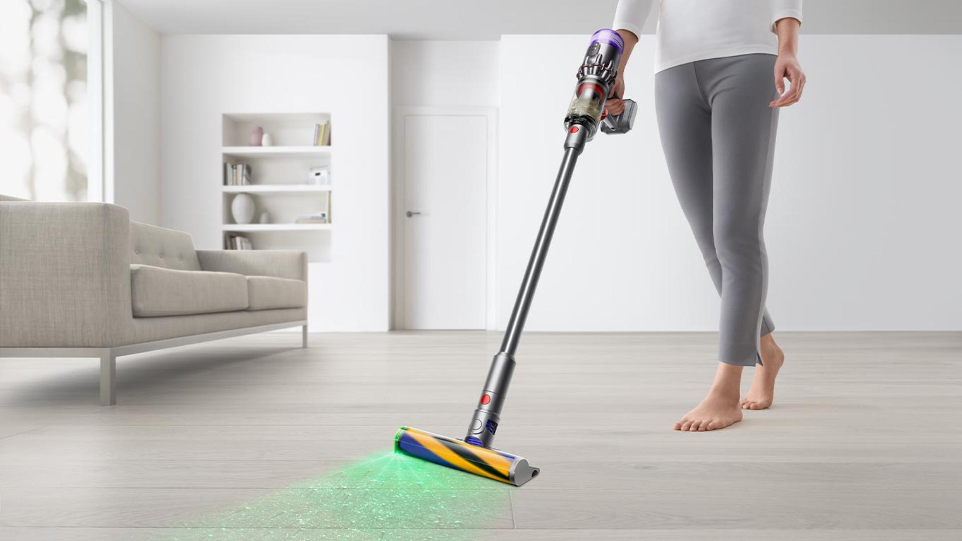 Lady using a Dyson Vcuum cleaner