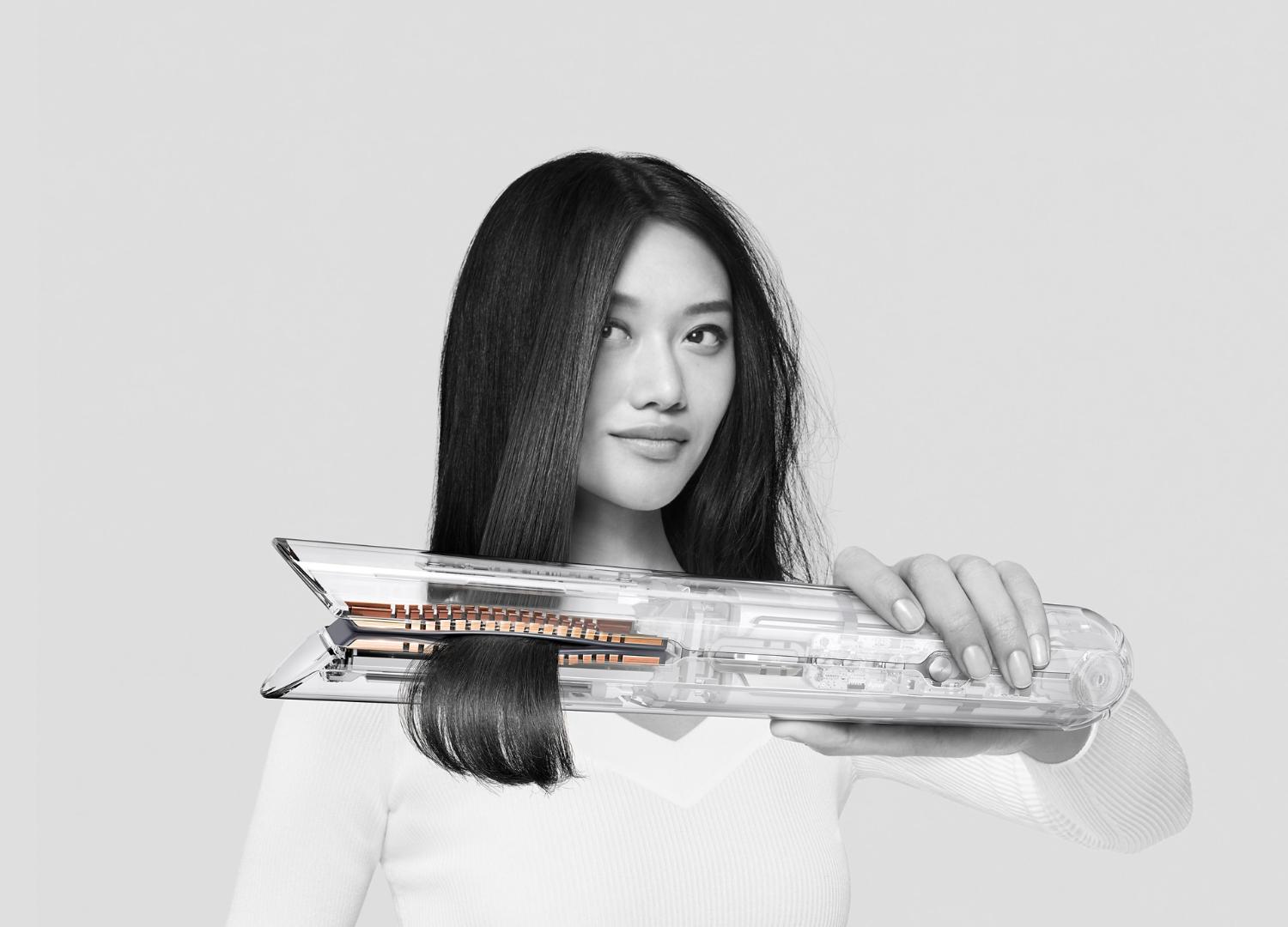 Dyson Airwrap used by model to straighten hair