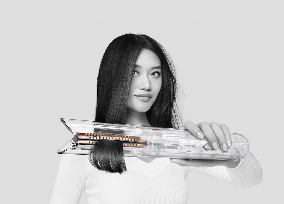 Dyson Airwrap used by model to straighten hair
