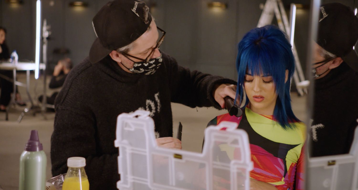 Larry King using the Dyson Corrale straightener.