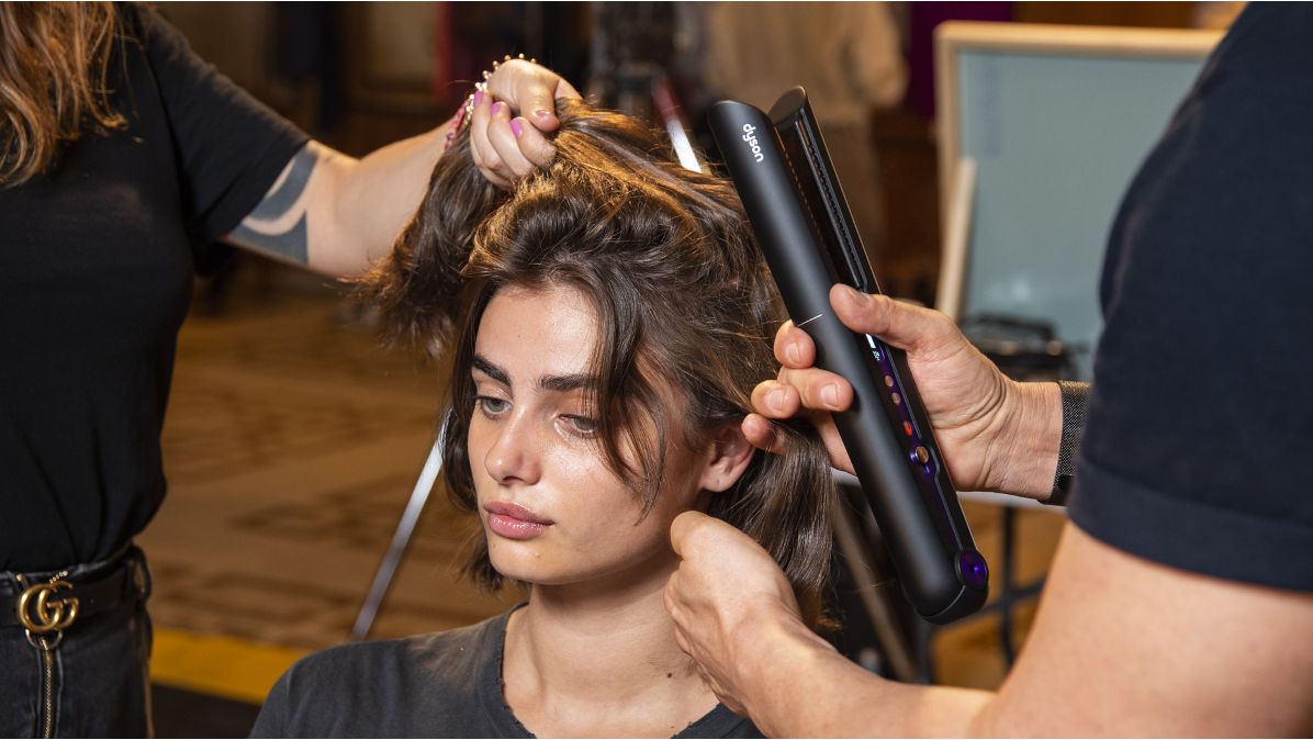 The Dyson Corrale straightener being used at Milan Fashion Week.