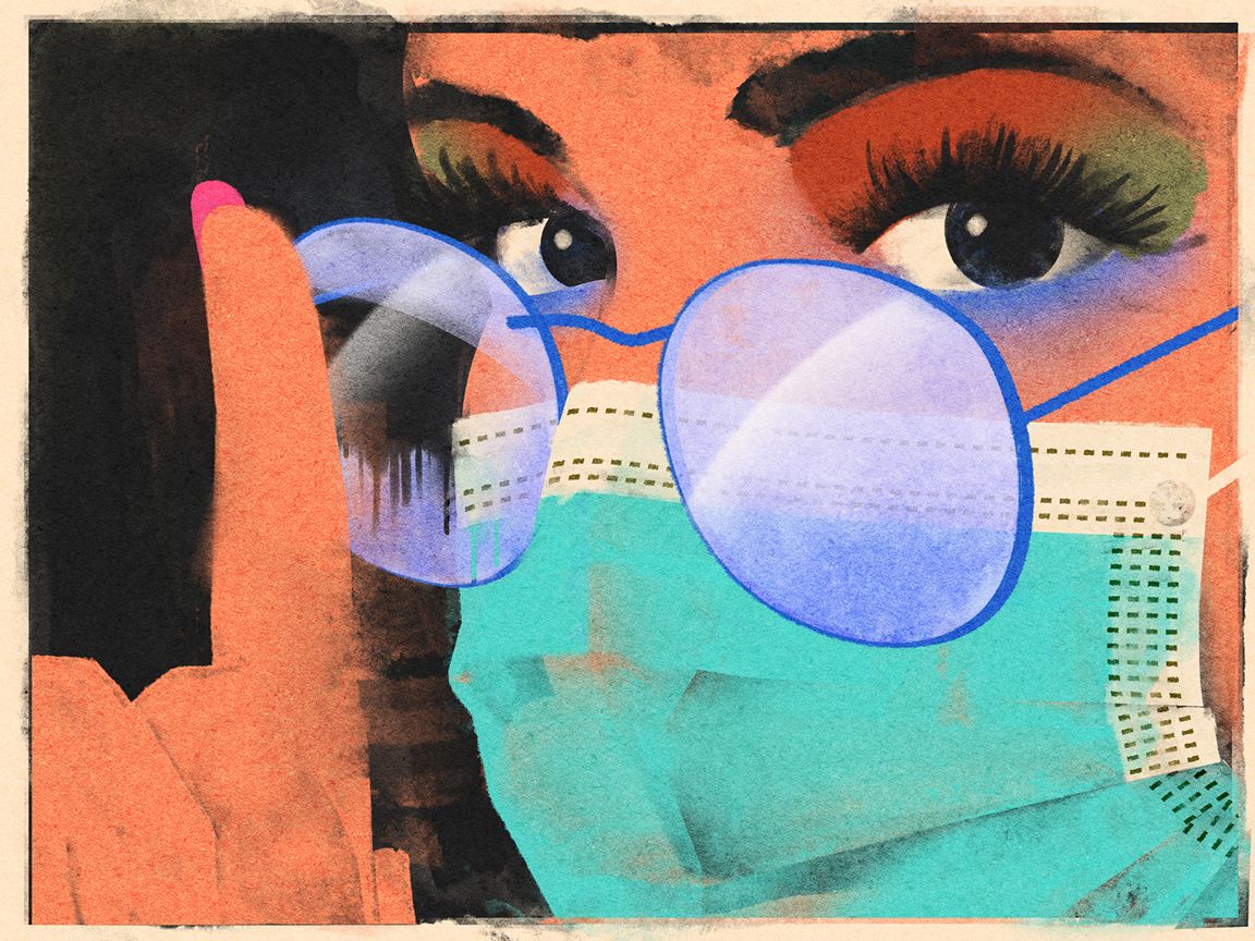 A woman wears a mask with glasses.