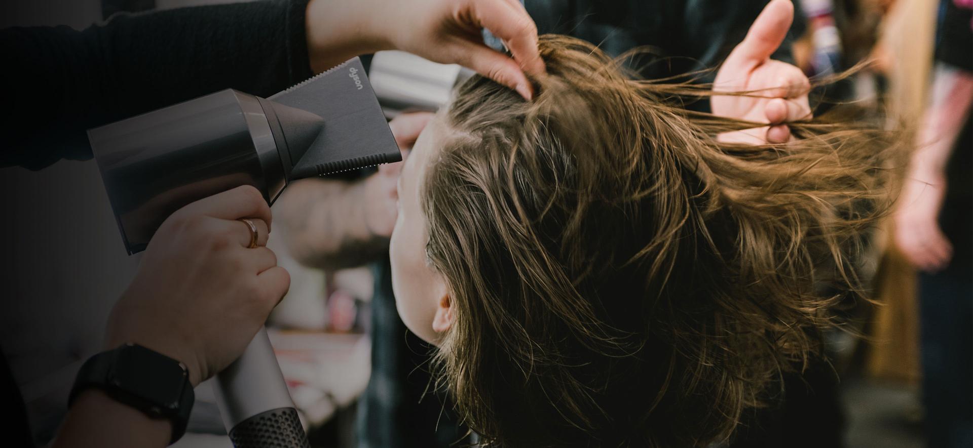Hair dryer being used backstage