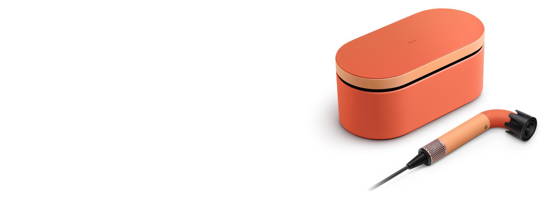 The Dyson Supersonic r™ hair dryer and Presentation case in the Ceramic apricot colourway.