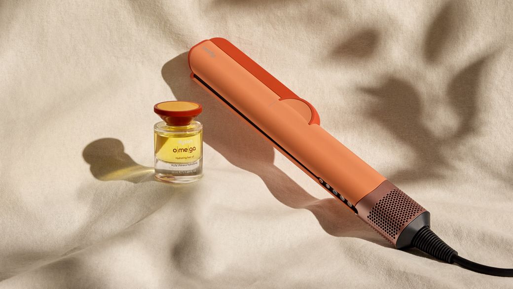 Dyson Airstrait dryer and straightener with Dyson Omega hydrating hair oil.