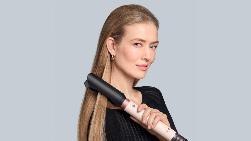 Model with long straight hair on the left and on the right the Dyson Airwrap Co-anda2x multi-styler and dryer.