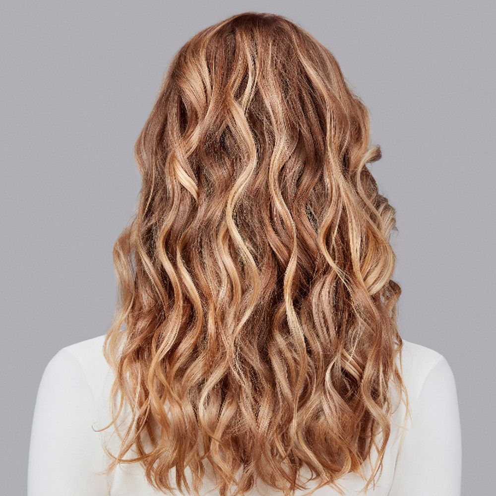 The results of using Dyson Chitosan Multi-use styling spray on blonde wavy hair.