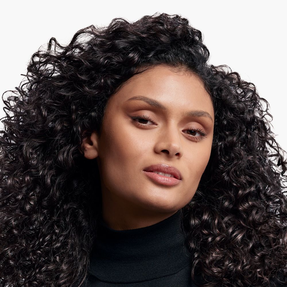 Model with tight curls.