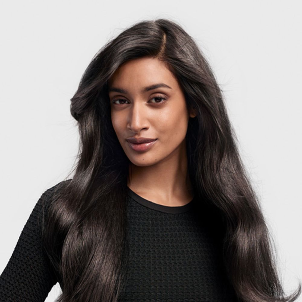 A model with their hair styled with the Dyson Airwrap i.d. multi-styler and dryer.