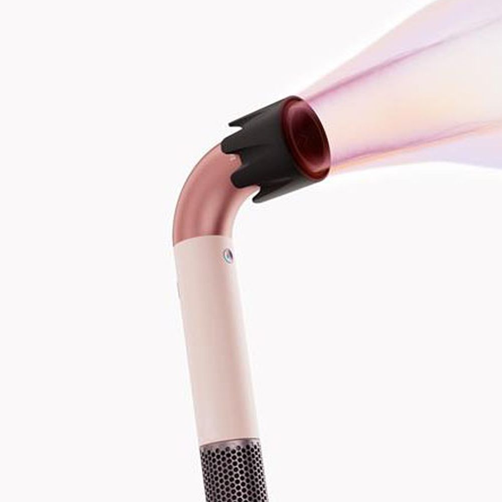 Dyson Supersonic r hair dryer with pink graphics showing the powerful airflow emitted from the device.