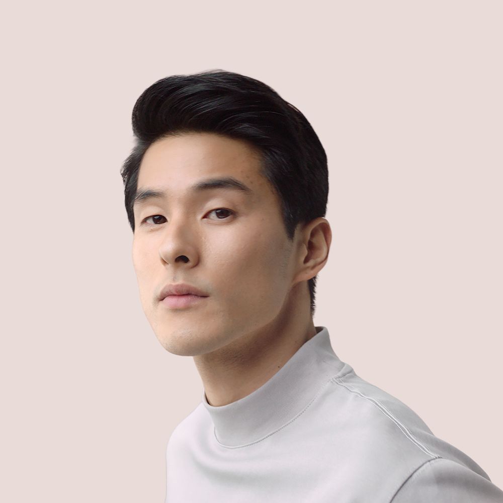 Model shows off his short hair styled with the Dyson Supersonic Origin hair dryer.