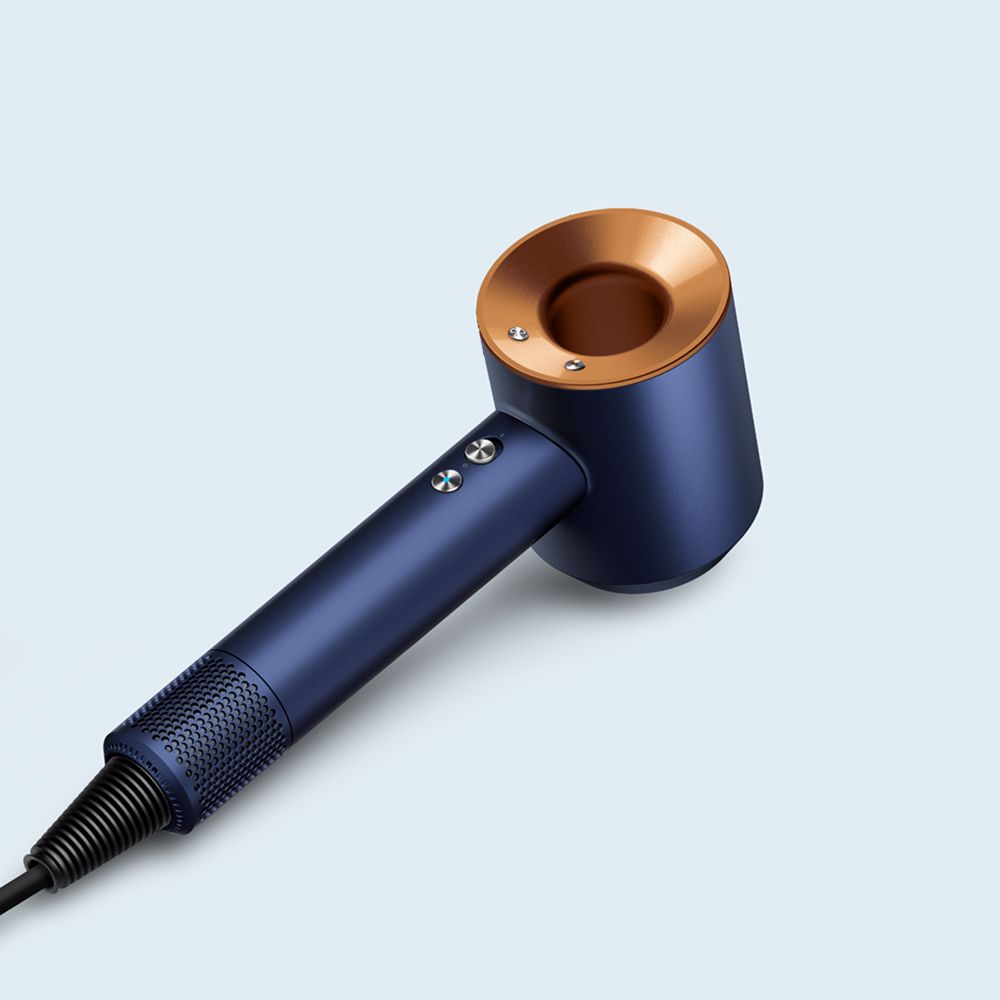 The Dyson Supersonic Origin hair dryer on a surface.