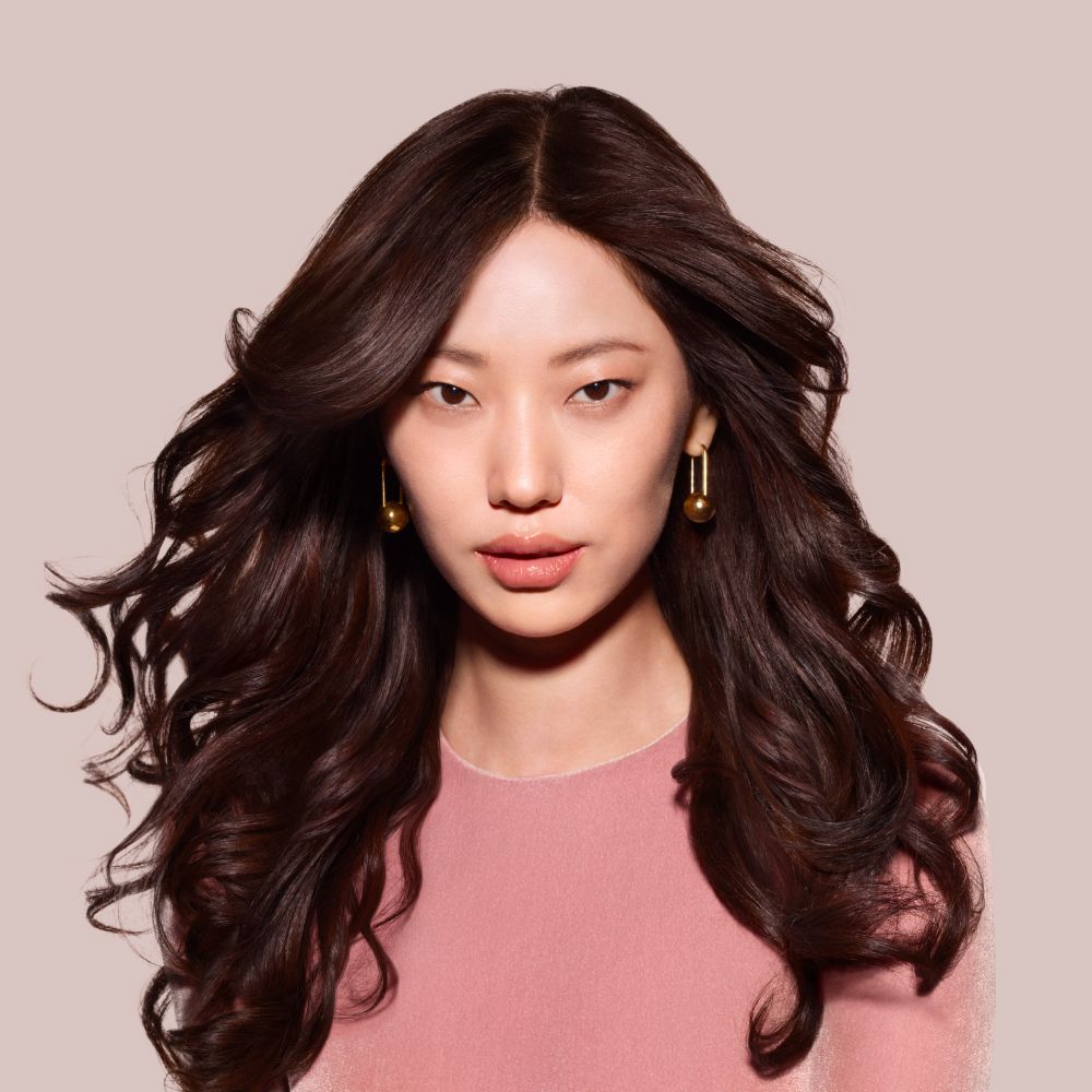 Model with hair styled with Dyson Beauty machines and products.