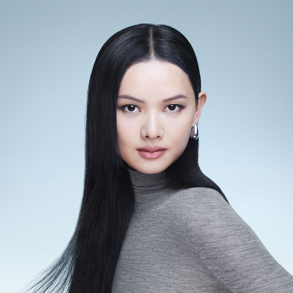 Model with hair styled using Dyson Beauty devices and products.
