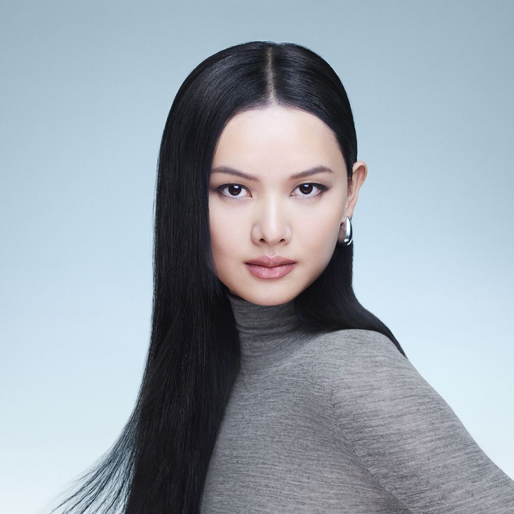 Model with hair styled using Dyson Beauty devices and formulations.
