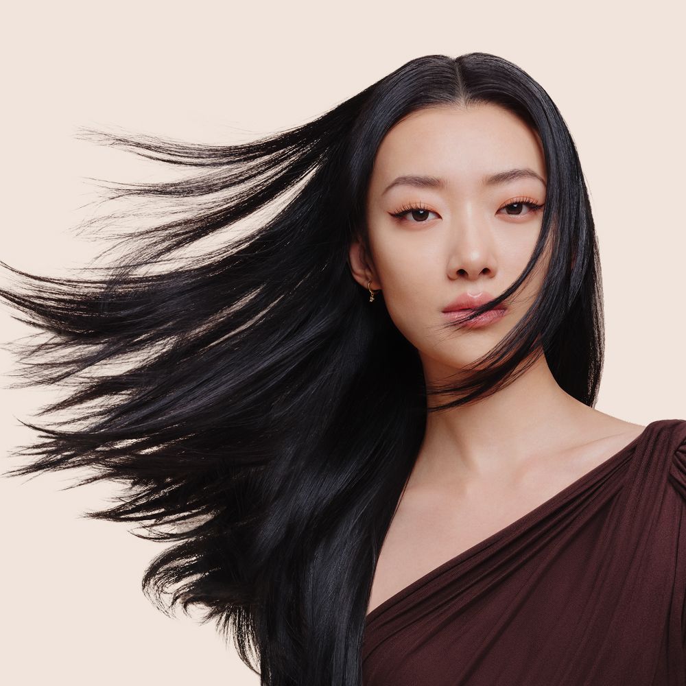 A model with her hair styled and dried with the Dyson Supersonic Travel hair dryer.