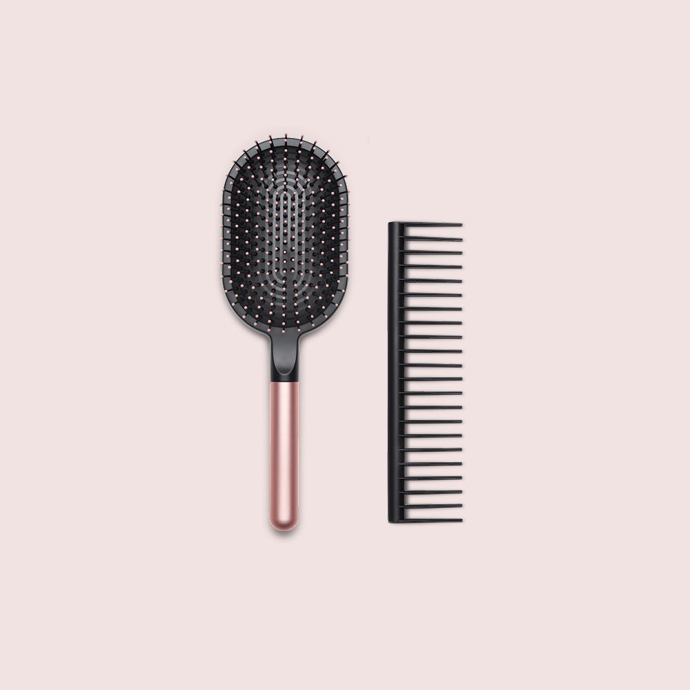  A Dyson paddle brush and De-tangling comb.