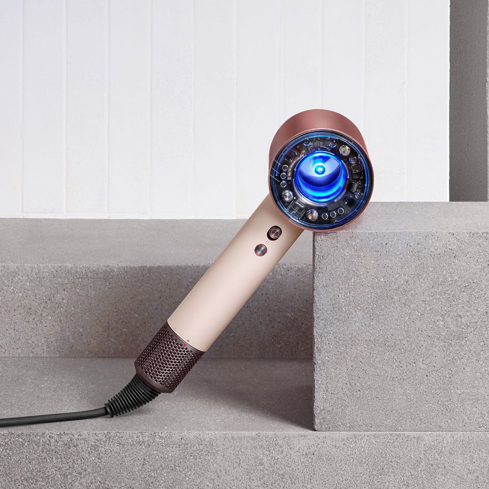 Model shows off her hair styled using the Dyson Supersonic Nural hair dryer.