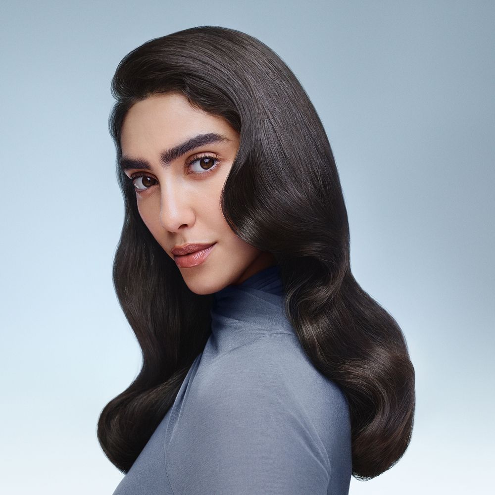 Model with hair styled using Dyson Beauty devices and products.
