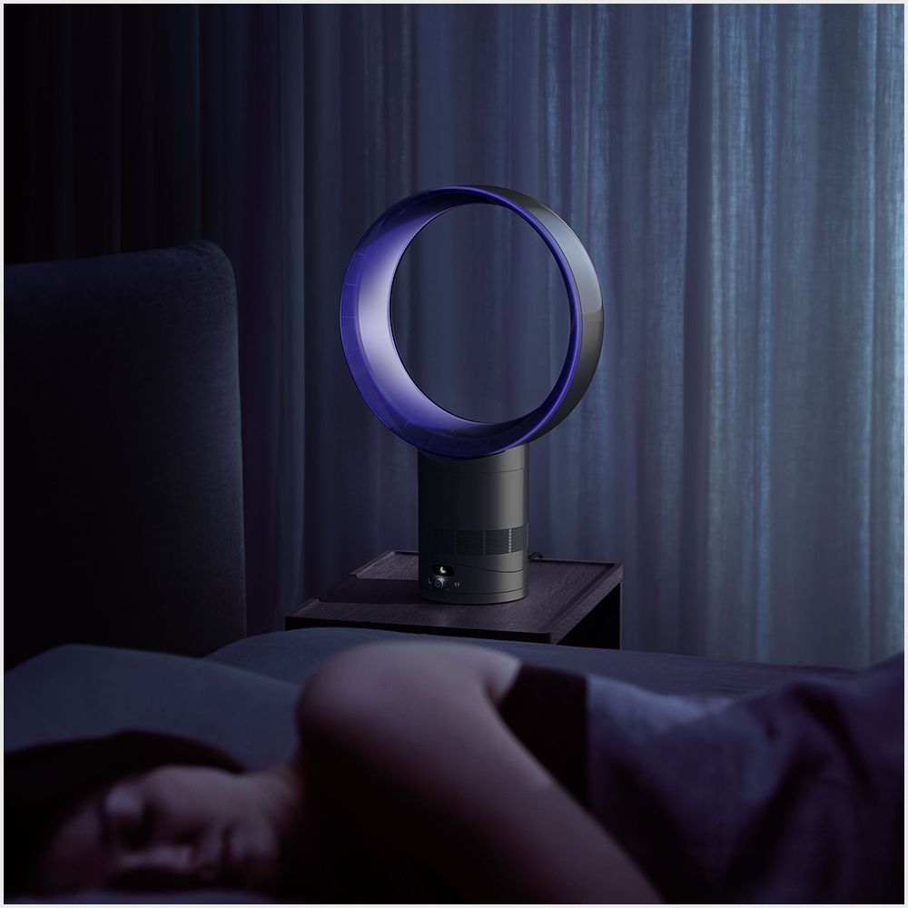 The Dyson Cool CF1 fan cooling a sleeping person with airflow.