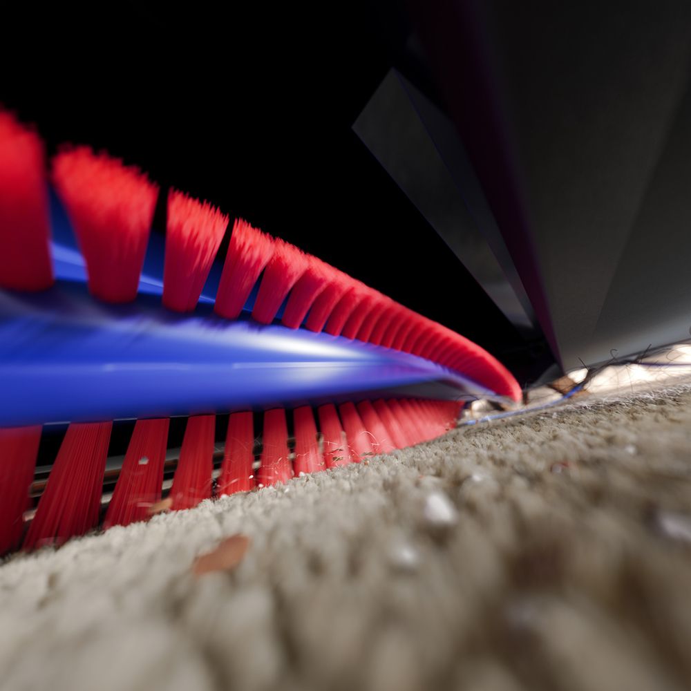 The Dyson Spot+Scrub Ai robot vacuum cleans dust and debris with powerful suction.