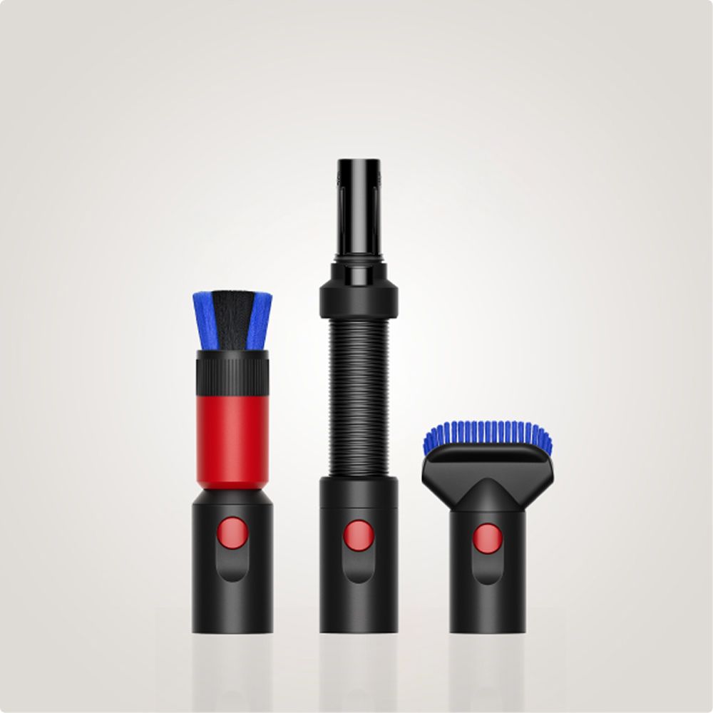 A selection of three Dyson vacuum attachments against a grey background.