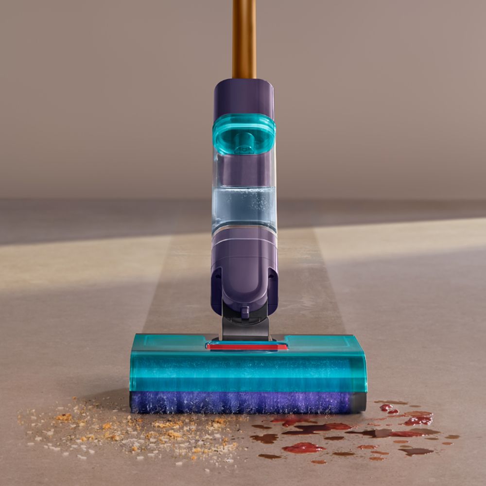 The Dyson Clean+Wash Hygiene hard floor cleaner washing a floor.