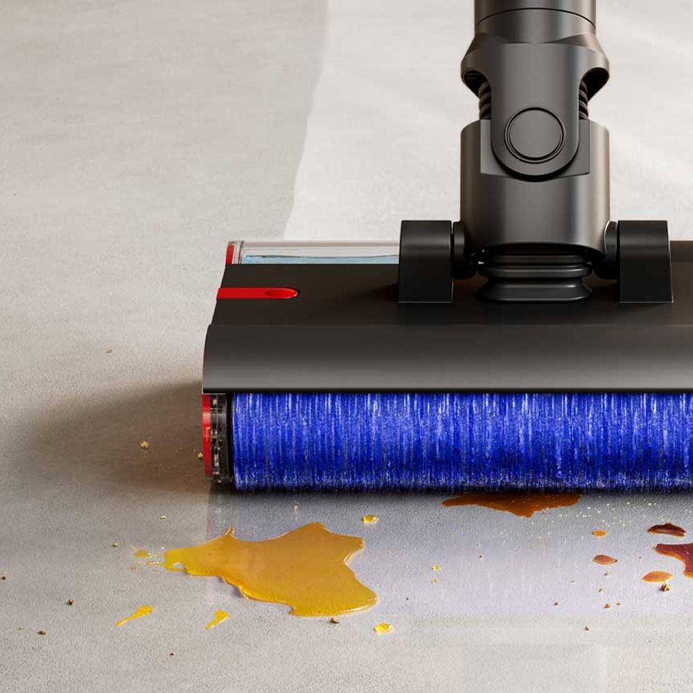 Close-up of the Dyson PencilWash cleaner head as it cleans wet and dry debris.
