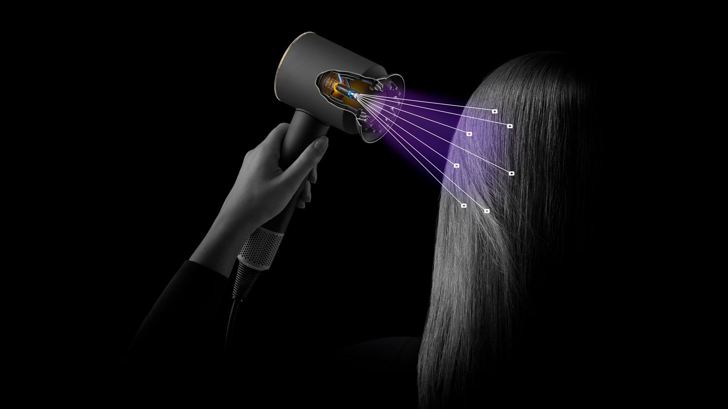 The Dyson Supersonic Nural hair dryer shown sensing the distance from a model's scalp.