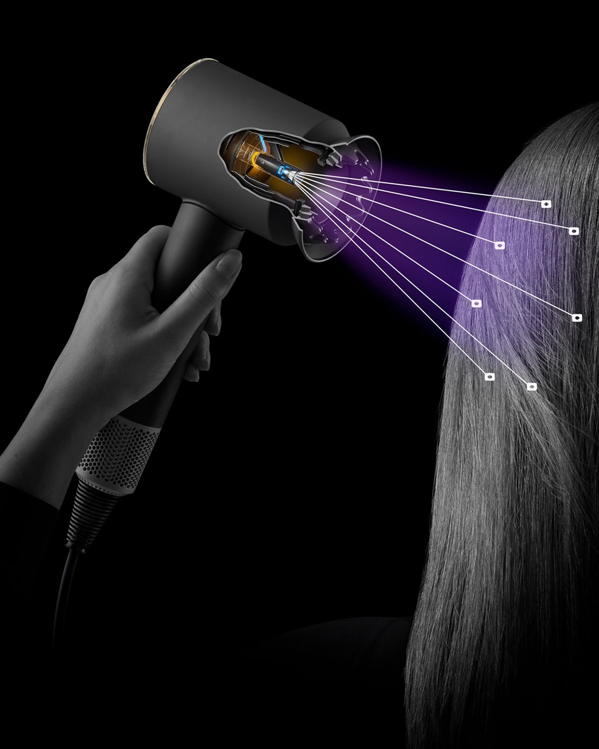 The Dyson Supersonic Nural hair dryer shown sensing the distance from a model's scalp.