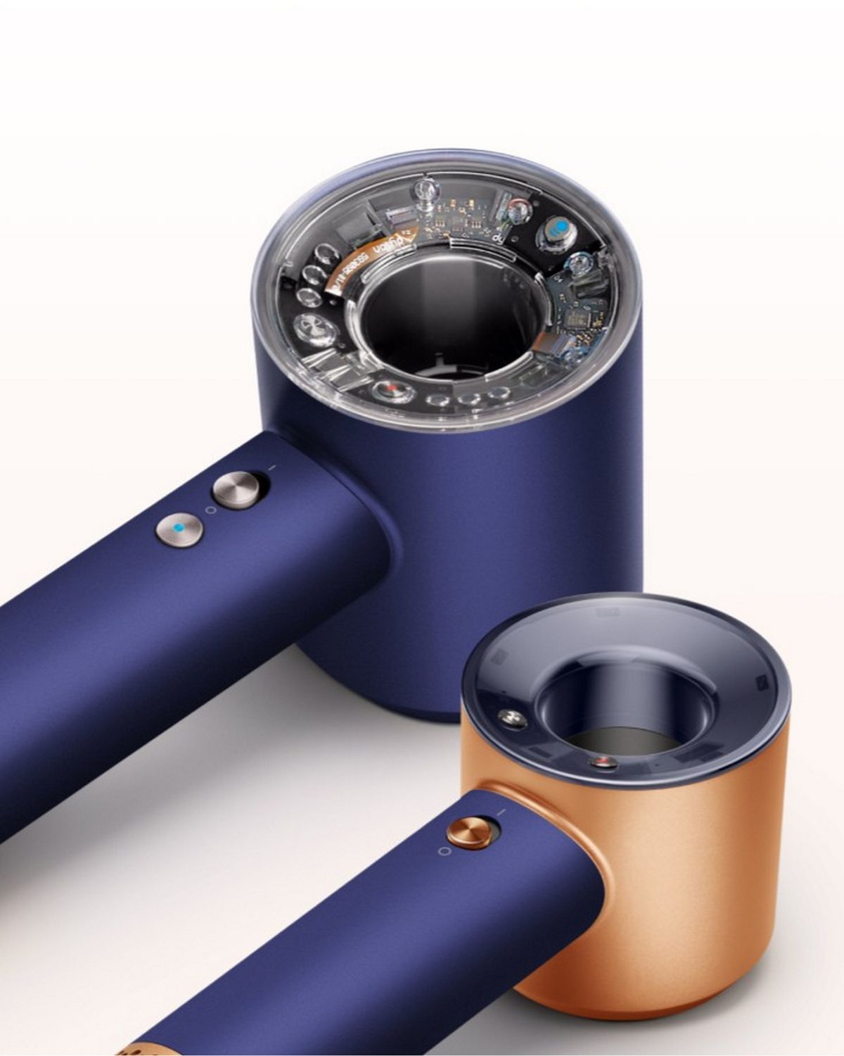 Dyson Supersonic Nural and Travel hair dryers next to each other.