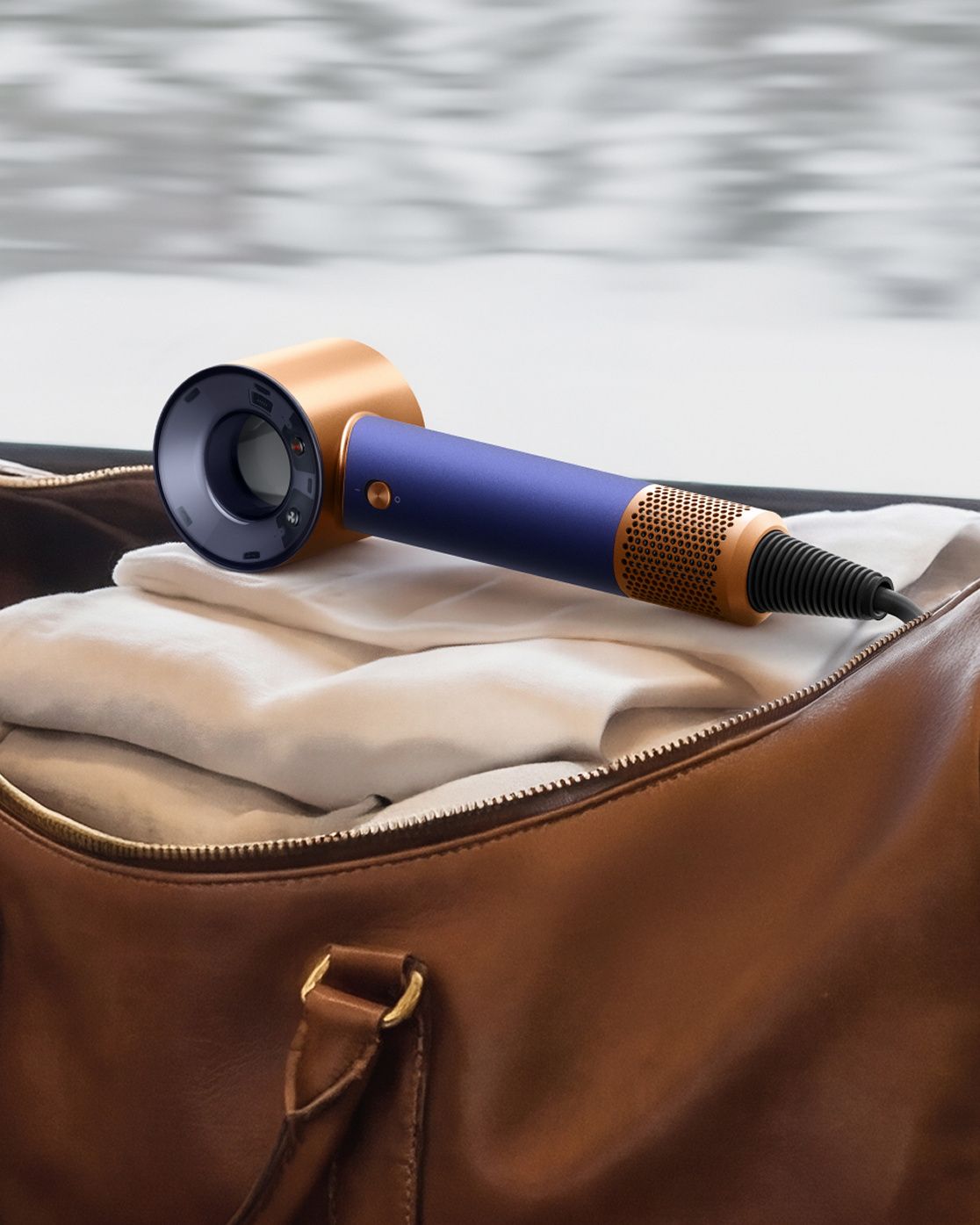 Dyson Supersonic Travel hair dryer in an carryall bag.
