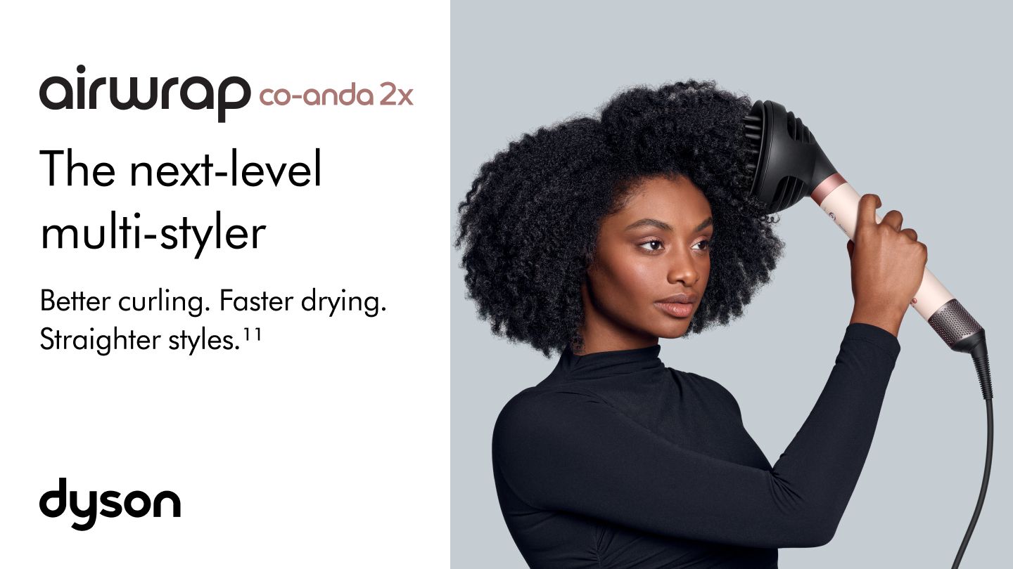 A model with dark hair adds curls using the Dyson Airwrap Co-anda2x multi-styler and dryer. The next-level multi-styler.