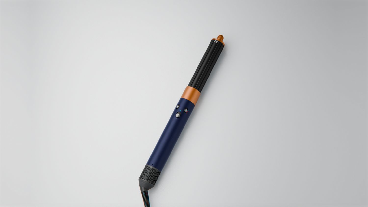Dyson Airwrap Origin multi-styler and dryer on a surface.