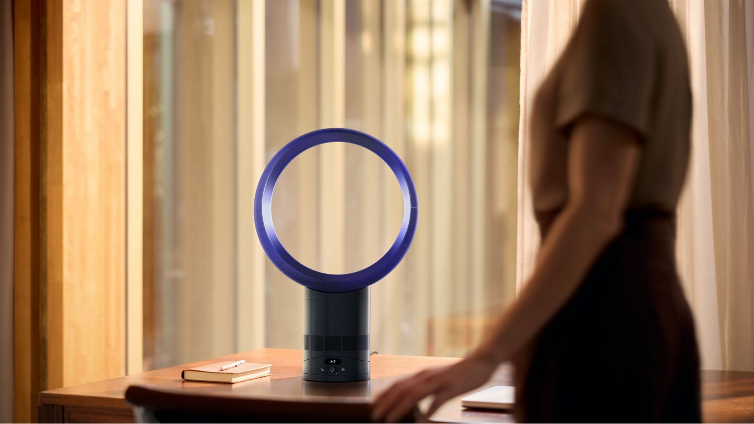 The Dyson Cool CF1 fan on the desk of a home office.