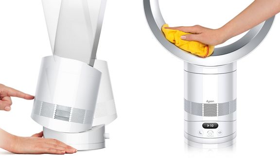 Der Dyson Cool CF1-Ventilator wird auf seinen Sockel gekippt und die Verstärkerschleife wird mit einem Tuch abgewischt.
