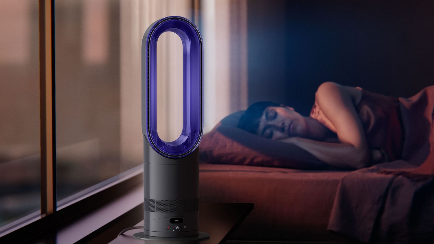 The Dyson Hot+Cool HF1 Rapid React heater and cooling fan operates quietly in a bedroom near a sleeping person.